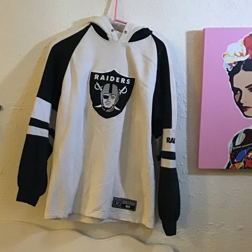 Raiders sweater originally over $150.00 has stain